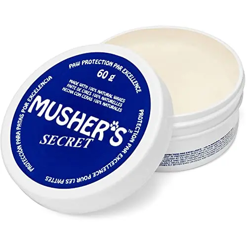 Musher's Secret Dog Paw Wax tin with blue label