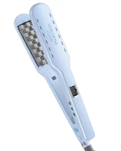 VOLOOM Classic blue volumizing flat iron on a heat-resistant mat