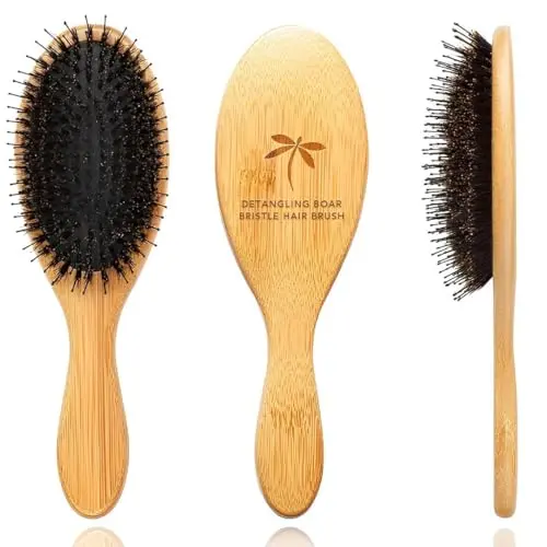 Belula Boar Bristle hair brush with a bamboo handle in an orange box