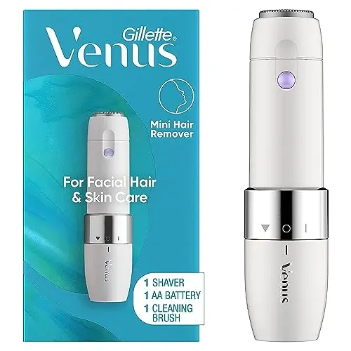 Gillette Venus Mini pink and white electric facial hair remover and dermaplaning tool.